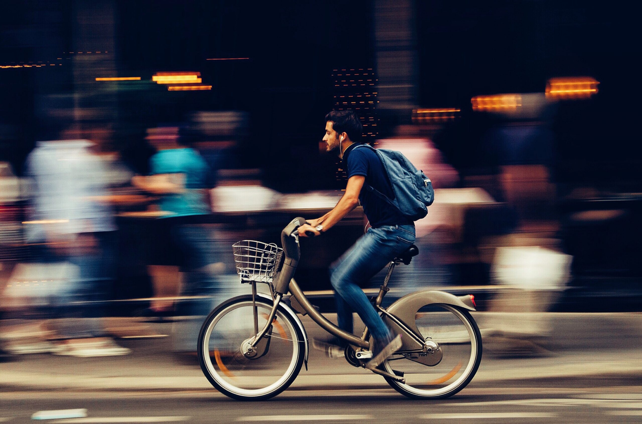 man-riding-bicycle-on-city-street-310983